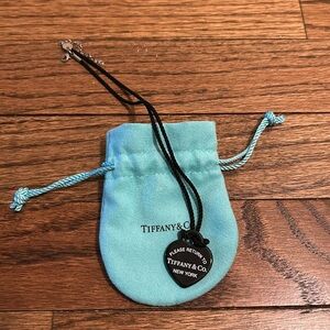 RARE! Return to Tiffany BONE CHINA charm pendant cord- 16-18inch. RTT
Authentic.